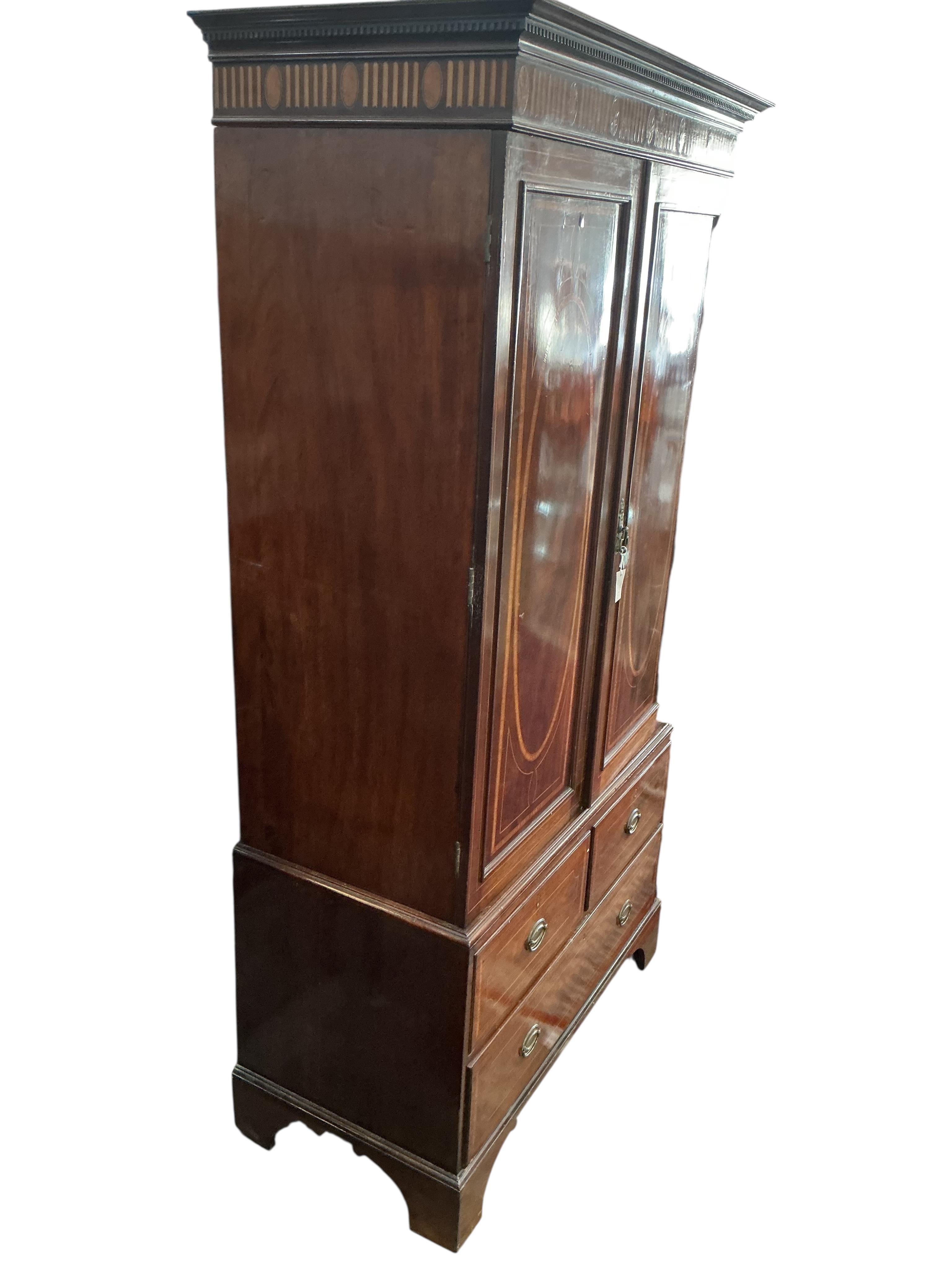 An Edwardian satinwood banded mahogany linen press, width 122cm, depth 58cm, height 230cm
